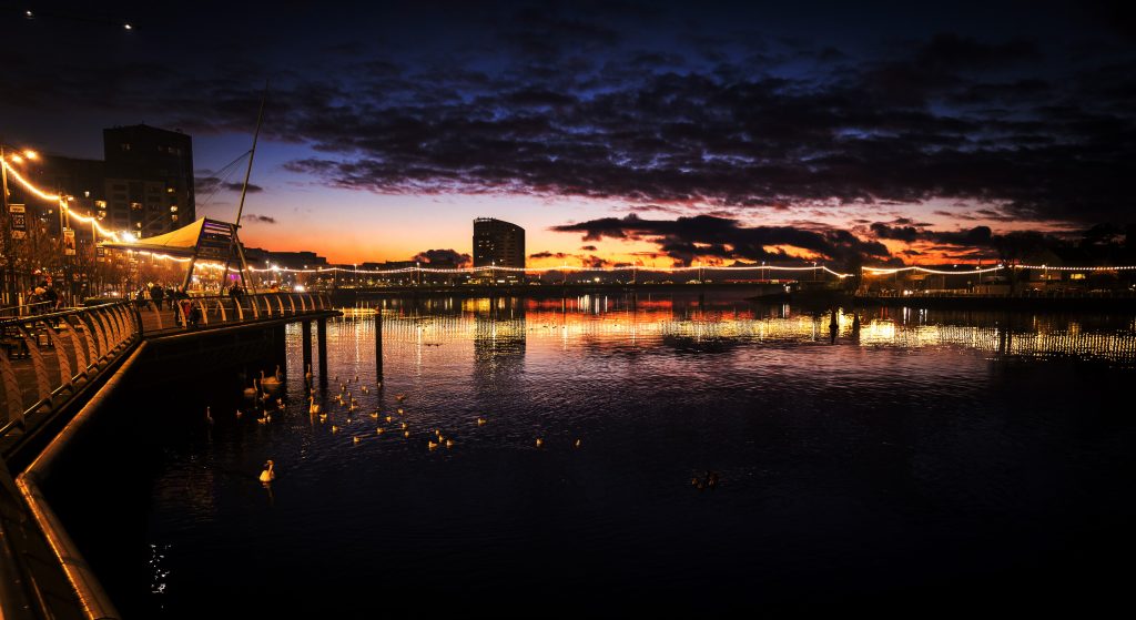 Nighttime view of Limerick City Centre beside the River Shannon.
